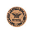 A round cork coaster in natural brown, featuring a black emblem and text design in the centre.