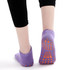Purple low cut kids' gripper socks with an orange non-slip sole, featuring a simple design and a logo.