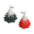 Christmas tree-shaped candles in green and red, featuring a textured design with a small tag.