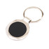 A metallic keyring with a round, glossy black surface and a silver circular attachment.