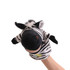 A plush zebra hand puppet in black and white stripes, featuring a soft head and ears, worn on a hand.