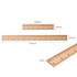 A dual scale wooden ruler featuring a natural finish with metric and imperial measurements, including two sizes.