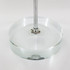 A clear circular base with a metal rod, designed for displaying desk flags.