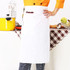 A white polyester canvas half apron with a pocket, featuring a logo, displayed against a kitchen backdrop.