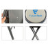 A grey folding stool with a padded seat and metal frame, featuring a logo on the seat and side.