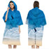 A hooded change towel in blue featuring a beach and wave design, with a logo on the front.