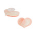 Two peach-coloured heart-shaped shoe charms with a translucent centre and an orange backing, featuring a logo.