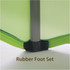 A close-up of a rubber foot set attached to a green stretch table cover, highlighting the material and stitching.