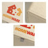 A medium tissue box in a textured beige finish, featuring colourful branding.