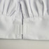 White adult chef hat with pleated design and fastening at the base, featuring a smooth fabric texture.