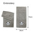 Two grey embroidered cotton hand towels featuring a panda design, one larger and one smaller, displayed with dimensions.