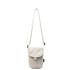 A small size canvas shoulder bag in light cream with a flap closure and an adjustable strap. Features a logo.