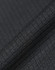 A close-up of textured black fabric, showcasing a sustainable jacquard knit pattern. Featuring a subtle sheen, it has a fabric brand logo.