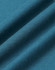 A close-up of a textured fabric in deep teal, showcasing the softness and weave of the premium cotton material.
