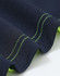A close-up of a navy polo shirt with bright green stitching and detailing along the edges. It features a logo.