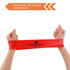 A red latex-free TPE fitness resistance band held by two hands, featuring a logo in the centre.