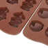 Custom shaped moulded ice cube tray featuring brown silicone, with various animal and object designs.