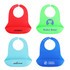 A collection of silicone bibs in red, green, blue, and light blue, featuring snap closures and logos.