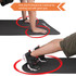 A black anti-slip yoga mat positioned for fitness workouts, featuring hands and feet demonstrating its grip.
