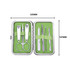 A stylish manicure set in a silver case featuring green interior, including scissors, nail clippers, and various tools. A stylish manicure set in a silver case featuring green interior, including scissors, nail clippers, and various tools.