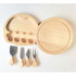 A cheese board set in light wood, featuring a round board and four stainless steel cheese knives with wooden handles.