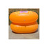 Two orange custom inflatable chairs stacked on a paved surface, featuring a logo on the front.