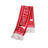 A red scarf with white fringe, featuring a logo and the word "SWITZER". Designed as a clothing accessory.