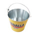A yellow metal ice bucket with a sturdy handle and a logo on the front.