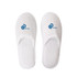 White hotel slippers featuring a logo on each slipper. The slippers have a soft, plush design.