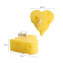 Heart-shaped candles resembling cheese, in a bright yellow colour with holes, measuring 65mm and 72mm in width.