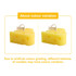 A pair of yellow cheese-shaped candles with a small label flag on each. One candle displays holes typical of cheese.