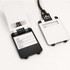 A set of ABS luggage tags in white and black, featuring a clear window and space for personal details.