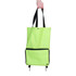 A bright green collapsible shopping trolley bag with a black zippered pocket at the front and black straps. A bright green collapsible shopping trolley bag with a black zippered pocket at the front and black straps.