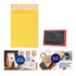 A small padded bubble envelope in yellow, featuring a logo, alongside a rubber stamp and promotional products. A small padded bubble envelope in yellow, featuring a logo, alongside a rubber stamp and promotional products.