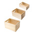 Three wooden storage boxes in light timber, varying in size, with open handles and a simple design. Three wooden storage boxes in light timber, varying in size, with open handles and a simple design.