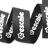 A ribbed fabric ribbon in black featuring a logo, measuring 22mm in width.
