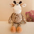 A soft, brown and cream plush giraffe toy with a round body and floppy limbs, set against a neutral background.