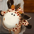 A plush giraffe hand puppet featuring a spotted pattern in orange and brown with a friendly facial expression.