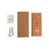 A cork wireless charger in a foldable design, accompanied by a user manual and a charging cable. It has a simple, natural appearance. A cork wireless charger in a foldable design, accompanied by a user manual and a charging cable. It has a simple, natural appearance.