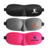 A cushioned eye mask in black, grey, and pink, featuring various logos. Each mask has an ergonomic design.