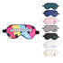 A collection of satin sleep masks in various colours, featuring different logos and a prominent pink mask with "SURPRISE ME" text.