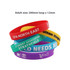 A collection of silicone wristbands in red, yellow, purple, and green, featuring various logos and text.