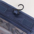 A navy blue travel hanging toiletry bag featuring a hook for easy hanging and zippered compartments.