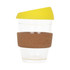 A reusable glass coffee cup with a cork band and a yellow lid, featuring a clear body.