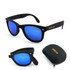Folding sunglasses in matte black with blue lenses, accompanied by a compact carrying case. Features a logo.