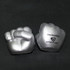Clenched fist-shaped stress relievers in silver, featuring a logo on one side.