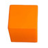 An orange cube-shaped stress reliever, made from soft material, featuring a logo.