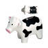 A milk cow-shaped stress reliever in white and black, featuring a logo on top.