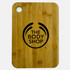A large bamboo cutting board featuring a round hole and a logo in black.