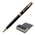 A metal ballpoint pen in lacquer black with gold trim, displayed in an elegant presentation box.